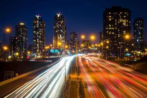 Long exposure shot of car lights on a highway at night. photo