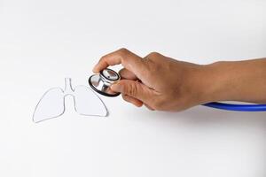 Stethoscope Examining Paper Lung Model in Hand photo