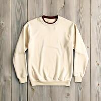 Beige crewneck trendy sweatshirt on wooden table, floor, top view. Mockup for design. A folded yellow sweat shirt. Blank sweatshirt mock up in front view, 3d rendering, 3d illustration photo