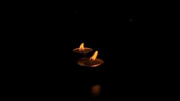 Close-up of the flame burning on the candle with isolated on a black background. Candle flame in the dark. flame on a black background video