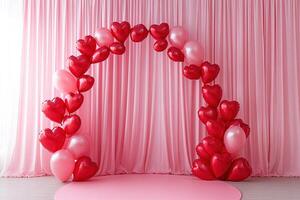 arc of red heart-shaped balloons on pink fabric curtain background, valentines day, wedding, birthday backdrop photo