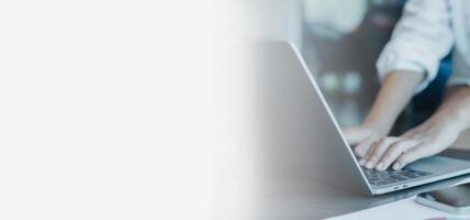 Free space for text and advertising, He is typing and analysing the document at the same time, Business woman working on laptop, Person typing on laptop keyboard. photo