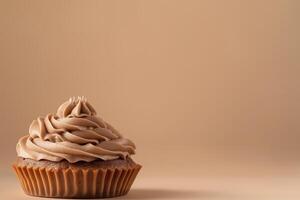 Side view of cupcake with creamy mousse on top, mocha or chocolate mousse dessert with smooth texture, soft brown background. Color trend concept, color of the year 2025. Banner with copy photo