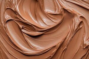 Close-up of creamy mocha or chocolate mousse smooth texture with elegant wave-like patterns. Rich texture of the dessert. Mocha mousse, color of the year. Background photo