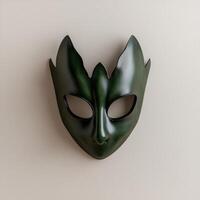 Green masquerade mask on beige background photo