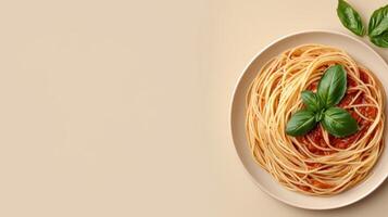 An overhead view of a plate of spaghetti with tomato sauce and basil photo