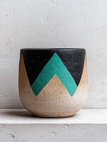 Hand painted ceramic planter with geometric pattern photo