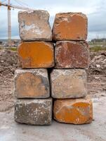 Stack of weathered concrete blocks at a construction site photo