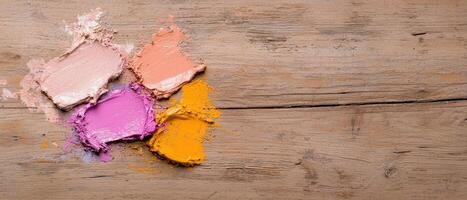 Close up of paint swatches on wooden background photo