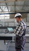 Chief Engineer With Laptop On PVC Windows Factory Analyzes The Production Process video
