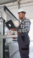 Engineer sets up a production line at programmable CNC machine video