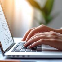 Brainstorming agenda collaboration concept. Hands typing on laptop in a bright, modern workspace. photo