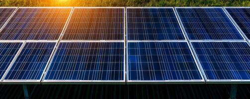 Peak energy grid concept. Solar panels capturing sunlight at sunrise. photo