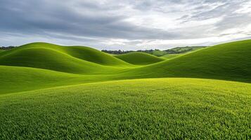 Lush green rolling hills under a cloudy sky. photo