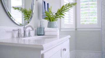 Modern bathroom decor with a stylish sink and fresh greenery. photo