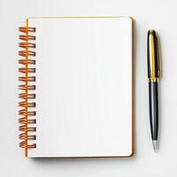 Blank notebook with a pen on a white background. photo