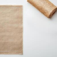 Plastic free campaign. Natural burlap fabric on a light background with a rolled piece beside it. photo