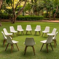 Workshops for healthy living concept. Chairs arranged in a circle on a grassy outdoor setting. photo