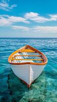 Sustainable management with fisher. A small boat floating in clear turquoise water under a blue sky. photo