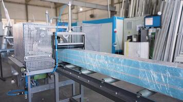 The process of packing pvc profiles on production line window factory video