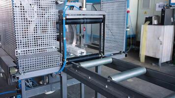 The process of packing pvc profiles on production line window factory video
