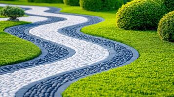 Curved stone path meandering through a manicured Japanese zen garden with bonsai trees and colorful shrubs in a tranquil setting photo
