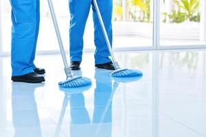 Professional cleaning team working diligently in a modern commercial space while maintaining cleanliness and hygiene photo