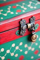 Metallic chest in dark red with olive and bronze accents, showcasing intricate patterns and a vintage lock mechanism for secure storage photo