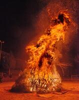 Pile of wood set on fire as a propitiatory act to chase winter photo