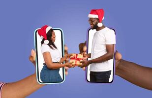 A married African American couple exchanges a thoughtful gift while using their smartphones, showcasing affection and connection despite being apart. The festive atmosphere highlights their bond. photo