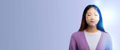 A person with closed eyes appears in a thoughtful pose, featuring a digital facial recognition overlay. The backdrop is minimalistic with a soft blue hue, emphasizing technology. photo