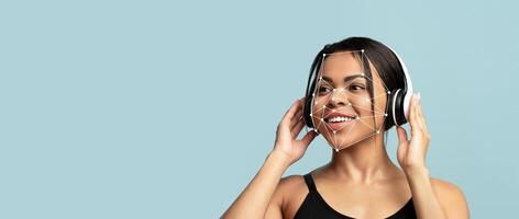 A woman with headphones smiles as facial recognition technology overlays her features. The background is a soft blue, emphasizing the connection between technology and human expression. photo