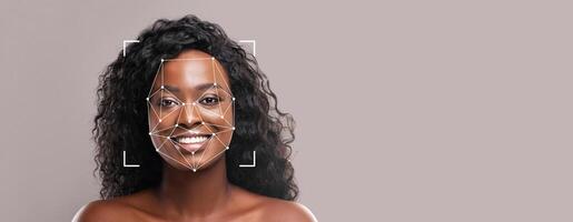 A person with curly hair smiles while facial recognition technology scans their features. This modern identification method focuses on enhancing security and user experience. photo