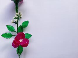 Artificial Flower with Pink Petals on White Background photo