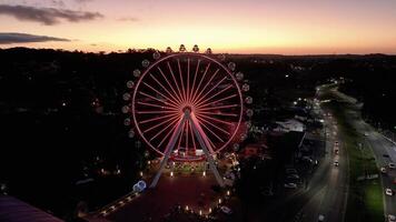High Angle of Illuminated Ferris Wheel in Canela Rio Grande do Sul Brazil. photo