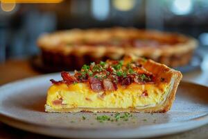 Quiche Lorraine with Bacon and Cheese on Rustic Wood photo