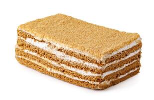 Delicious layered cake with cream filling presented on a white background for dessert enthusiasts photo