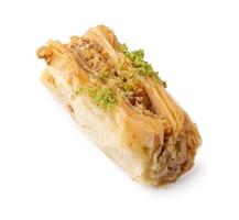 Delicious baklava topped with crushed pistachios served on a plain background for a tempting dessert experience photo