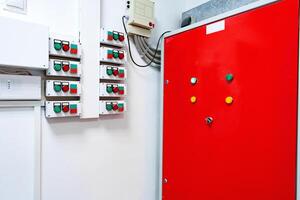 Control panel with various switches and indicators in a utility room designed for efficient operation photo