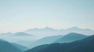 Multiple mountain ridges fading into the distance, creating a serene and minimalist landscape photo