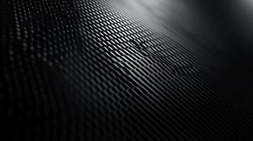 Dark metallic mesh grid reflecting light creating a modern abstract background photo