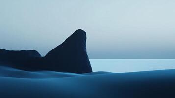 Minimalist blue landscape featuring a sharp rock formation in a desert by the sea, creating a serene and otherworldly atmosphere photo