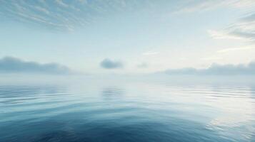 Tranquil ocean surface mirroring soft clouds under a serene sky, creating a peaceful atmosphere photo