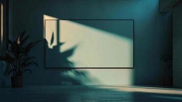 Teal room with empty frame mockup hanging on wall, plants, and window light casting shadows photo