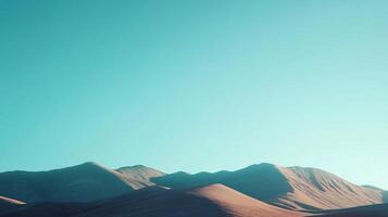 Minimalist landscape showcasing the beauty of desert mountains under a vibrant turquoise sky photo