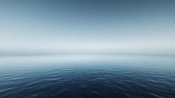 Calm ocean water meets a foggy sky, creating a serene and minimalist atmosphere photo
