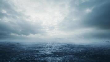 Dramatic clouds covering the horizon over a dark and stormy sea creating a moody atmosphere photo