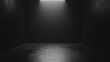 Empty black room with concrete floor and light beam shining down, perfect for displaying products or creating a dramatic atmosphere photo