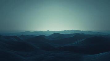 Rolling hills fading into the distance under a twilight sky photo