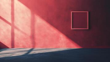 Sunlight illuminating empty frame hanging on red wall in room with concrete floor photo